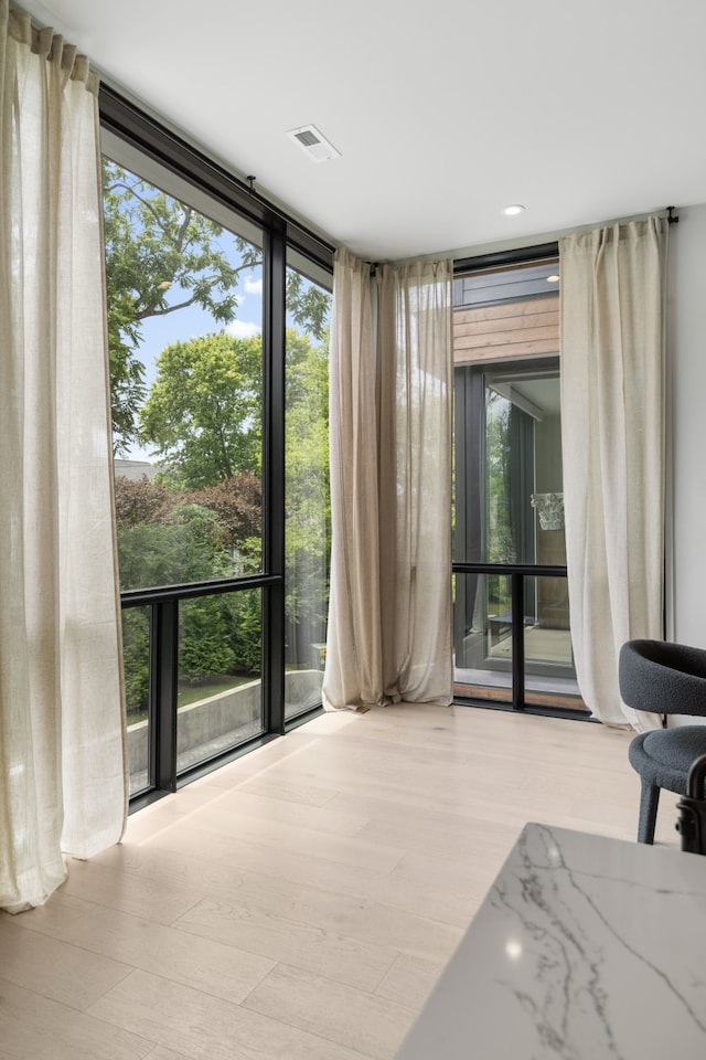 interior space featuring expansive windows and a wealth of natural light