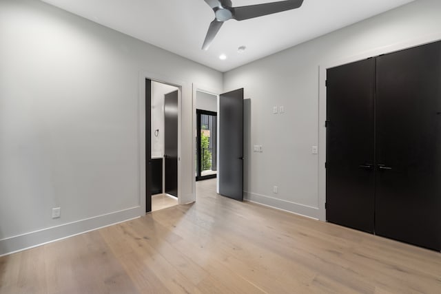 unfurnished bedroom featuring ceiling fan, light hardwood / wood-style flooring, and a closet