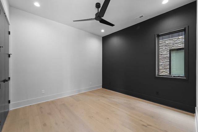 unfurnished room featuring ceiling fan and light hardwood / wood-style flooring