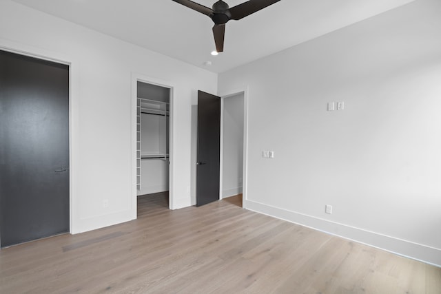 unfurnished bedroom with light hardwood / wood-style floors and ceiling fan