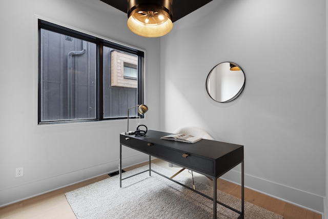 office area with hardwood / wood-style floors