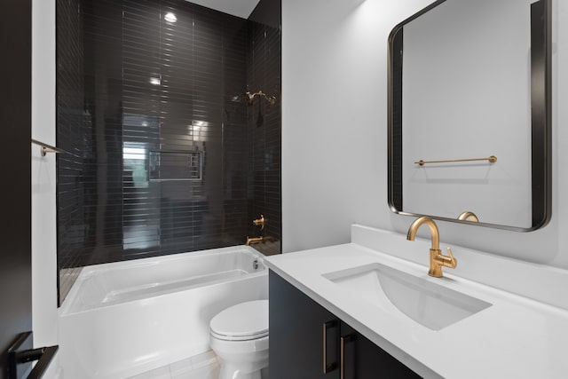 full bathroom with vanity, tile patterned flooring, tiled shower / bath, and toilet