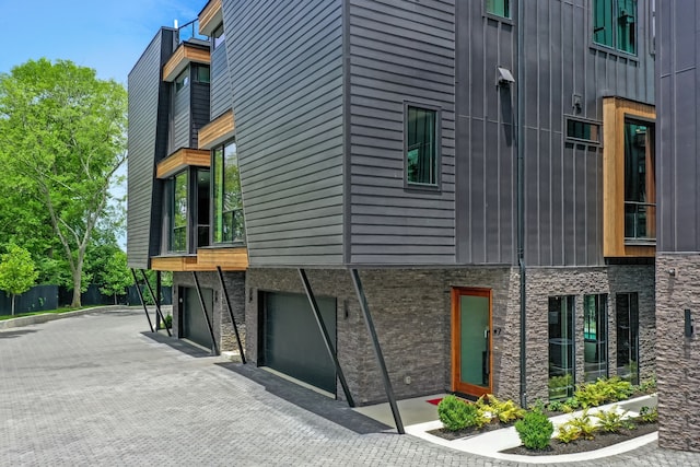 view of property exterior with a garage