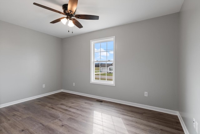 spare room featuring ceiling fan and wood-type flooring