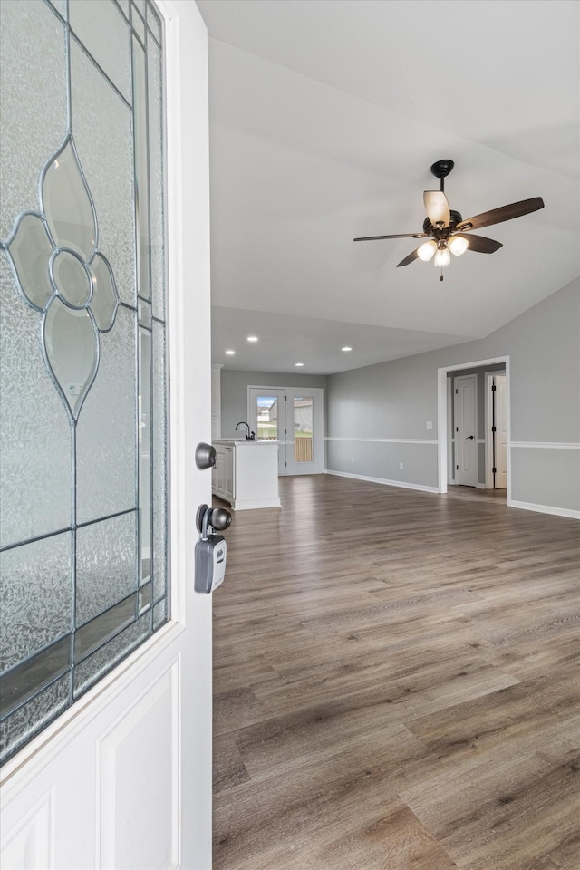 entrance foyer with hardwood / wood-style floors and ceiling fan