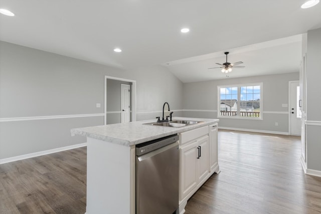 kitchen with dishwasher, white cabinets, a center island with sink, and sink