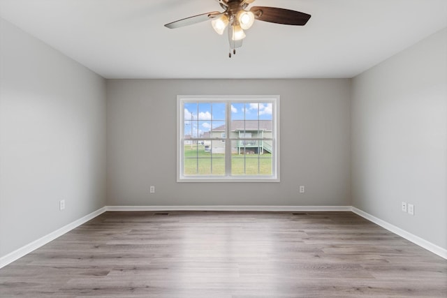 unfurnished room featuring ceiling fan and light hardwood / wood-style floors