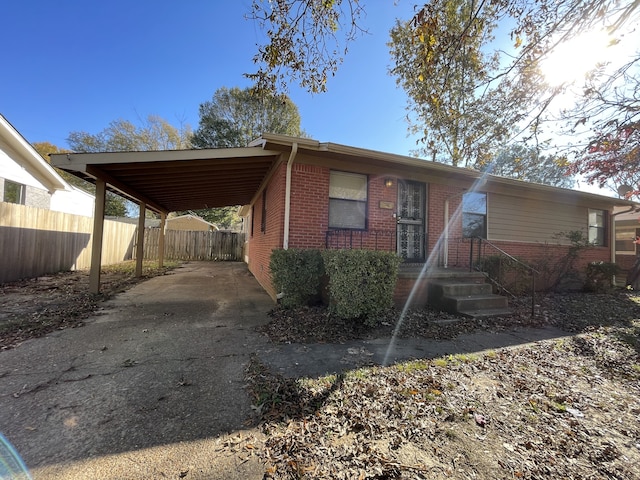 view of front of property featuring a carport