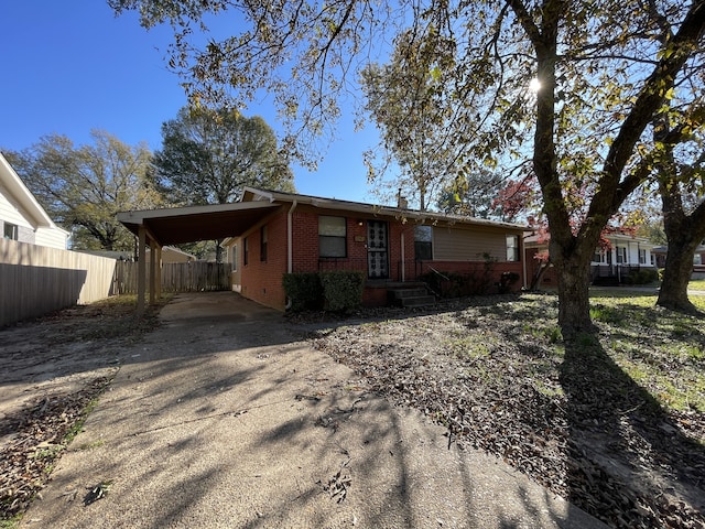 view of front of home featuring a carport