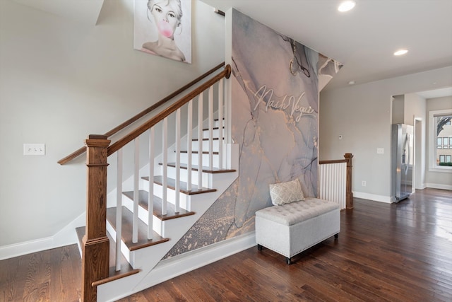 staircase with wood-type flooring