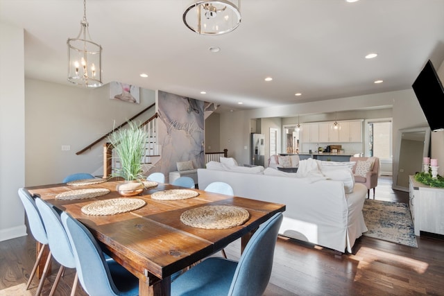 dining room featuring a chandelier and dark hardwood / wood-style floors