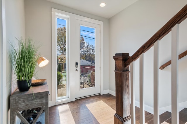 doorway with wood-type flooring