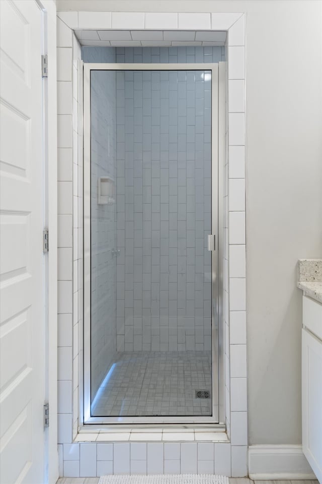 bathroom with vanity and an enclosed shower