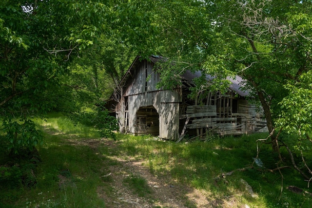 view of side of property with an outbuilding