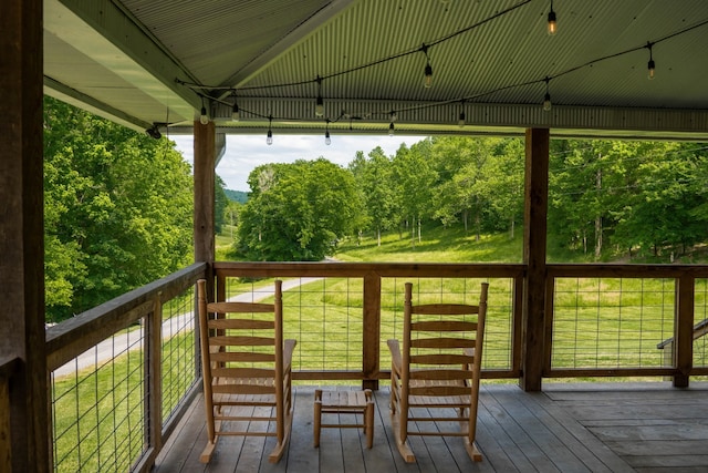 wooden terrace with a yard