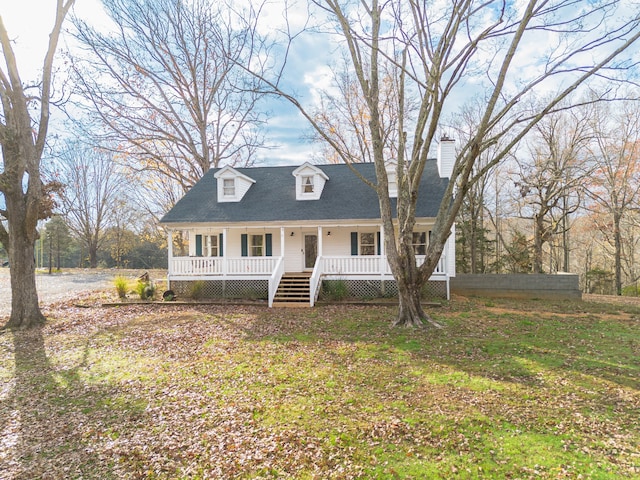 cape cod-style house with covered porch