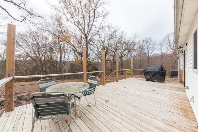 wooden terrace with area for grilling