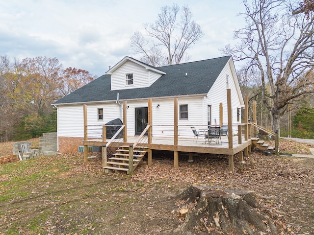 rear view of property with a deck