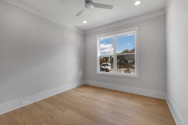 spare room featuring ceiling fan, light hardwood / wood-style floors, and crown molding