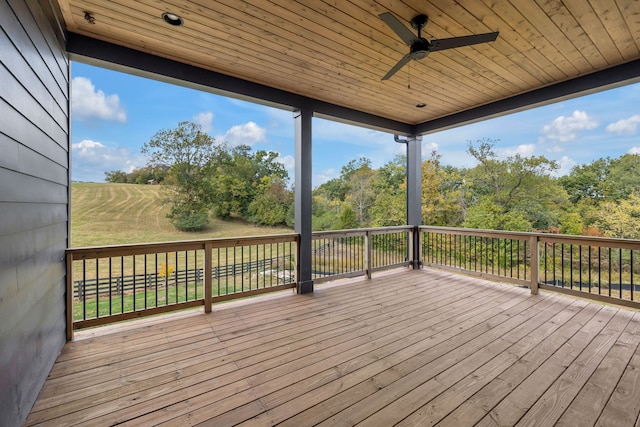 wooden deck featuring ceiling fan