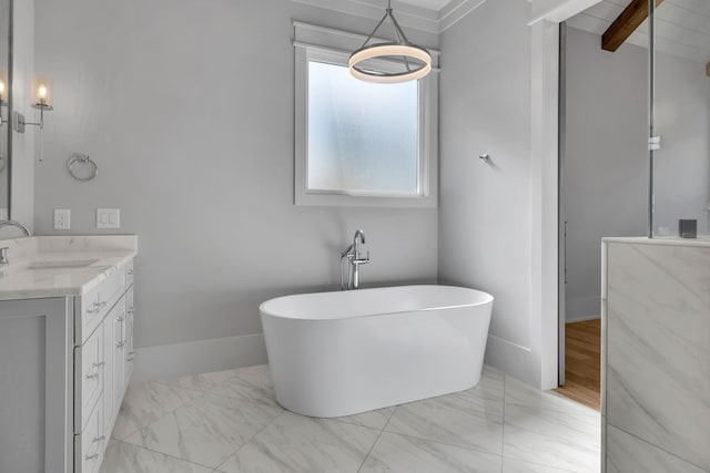 bathroom featuring beam ceiling, a bathing tub, and vanity