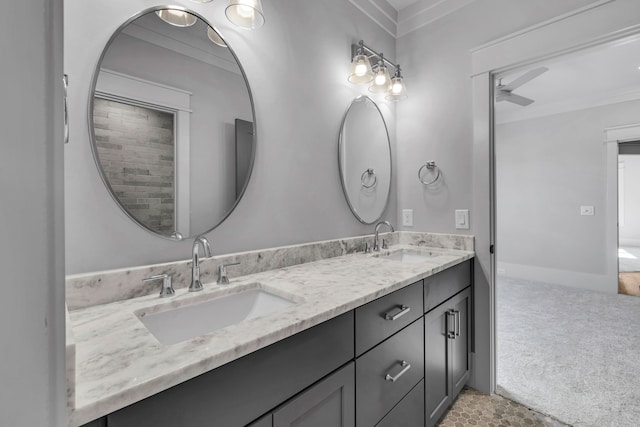 bathroom with ceiling fan, crown molding, and vanity