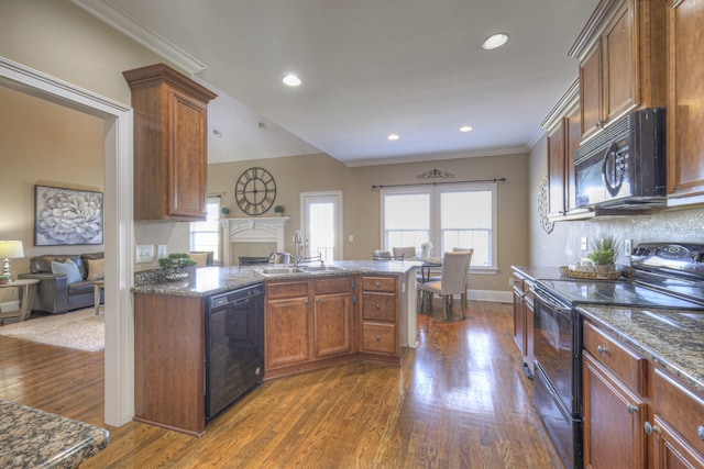 kitchen featuring dark hardwood / wood-style flooring, sink, ornamental molding, and black appliances