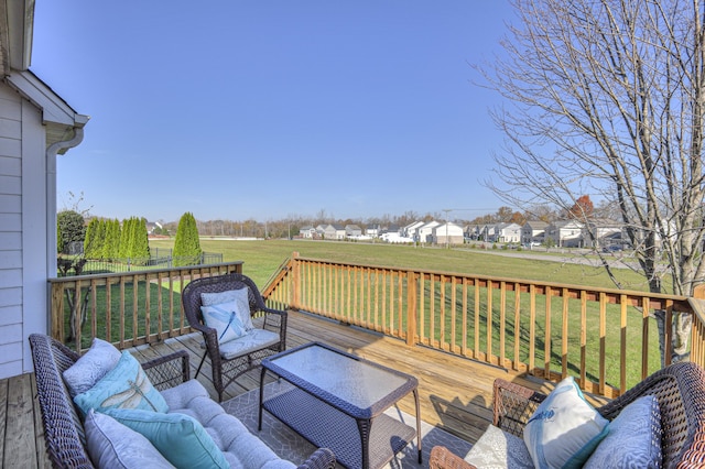 deck featuring outdoor lounge area and a yard