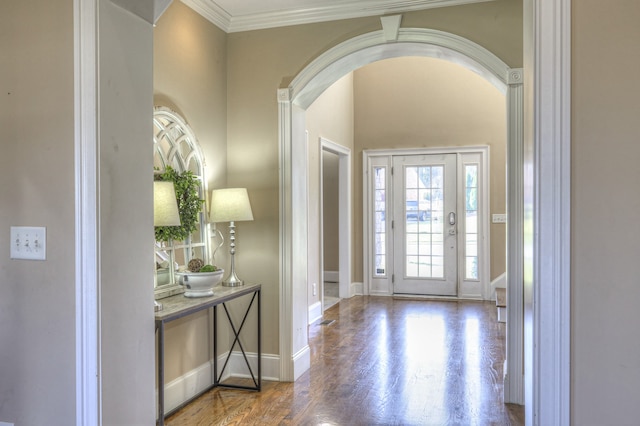 entrance foyer with hardwood / wood-style floors and ornamental molding