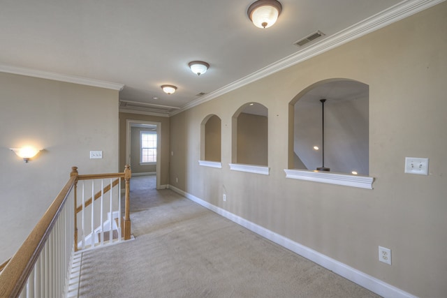 hallway with light colored carpet and ornamental molding