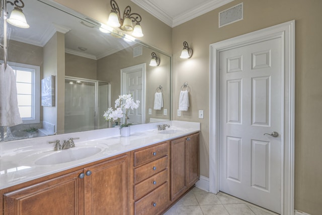 bathroom with vanity, an inviting chandelier, crown molding, tile patterned flooring, and a shower with shower door