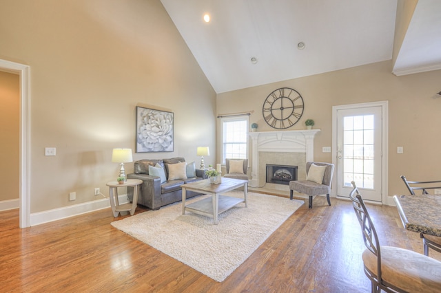 living room featuring hardwood / wood-style floors and high vaulted ceiling