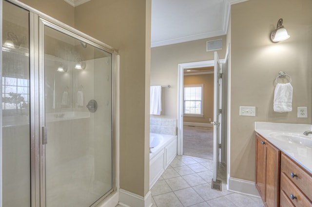 bathroom with tile patterned floors, vanity, ornamental molding, and independent shower and bath