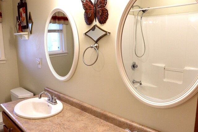 full bathroom with shower / washtub combination, toilet, and vanity