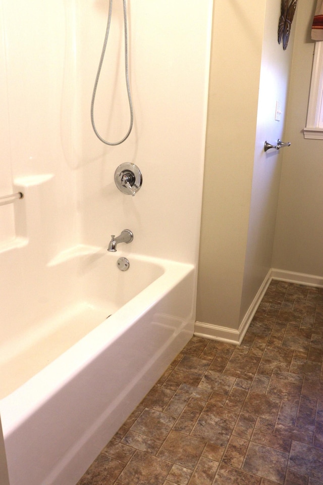 bathroom featuring washtub / shower combination