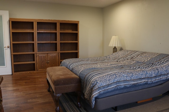 bedroom featuring dark hardwood / wood-style flooring