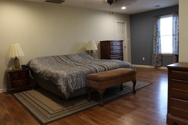 bedroom featuring dark hardwood / wood-style flooring