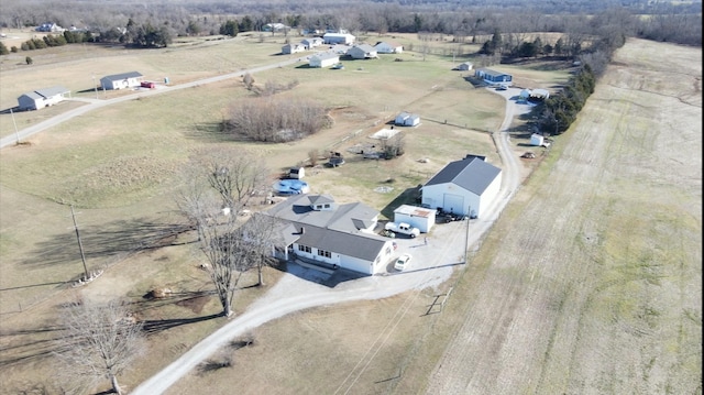 birds eye view of property with a rural view