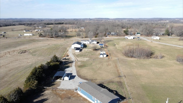 birds eye view of property featuring a rural view