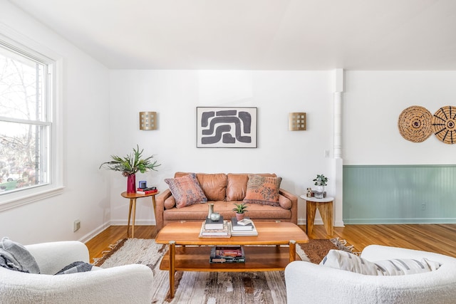 living room with a wealth of natural light and hardwood / wood-style flooring