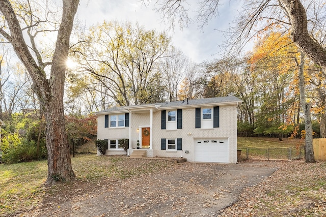 raised ranch featuring a garage