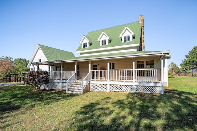 country-style home with covered porch and a front lawn