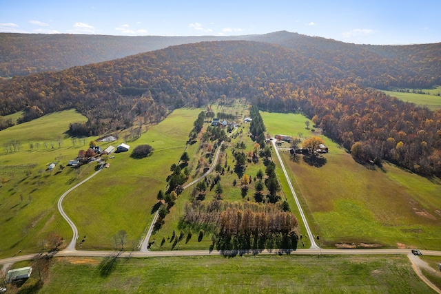 drone / aerial view featuring a mountain view and a rural view