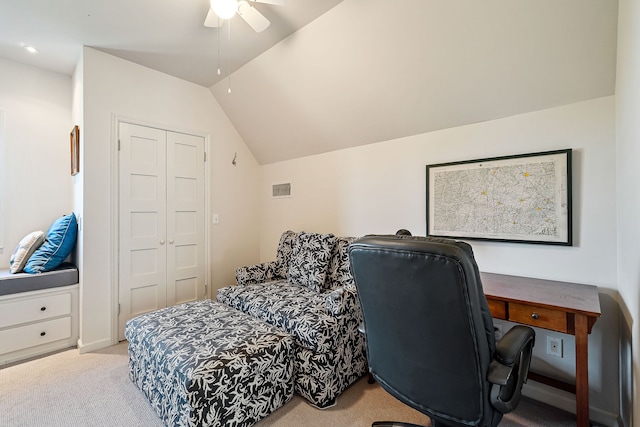 home office with ceiling fan, light colored carpet, and vaulted ceiling