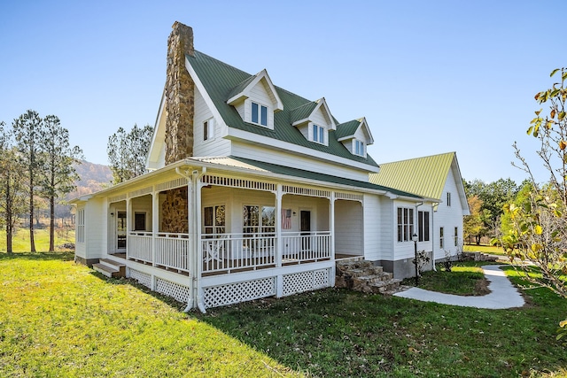 view of front of house with a front lawn and covered porch