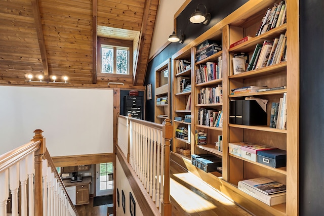 interior space featuring vaulted ceiling with beams, wooden ceiling, and hardwood / wood-style flooring