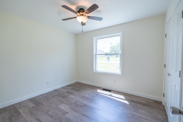 spare room with ceiling fan and light hardwood / wood-style flooring