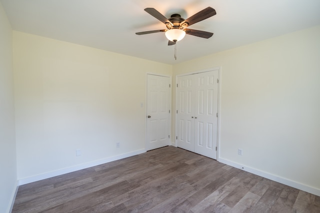 empty room featuring ceiling fan and wood-type flooring