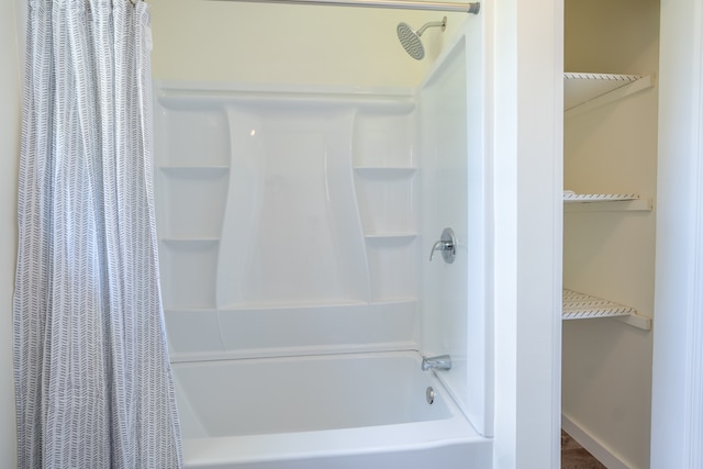 bathroom featuring shower / tub combo with curtain