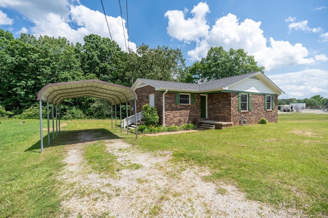 single story home with a front lawn and a carport